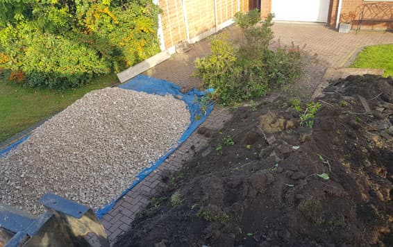Grab hire truck delivering limestone and removing waste.