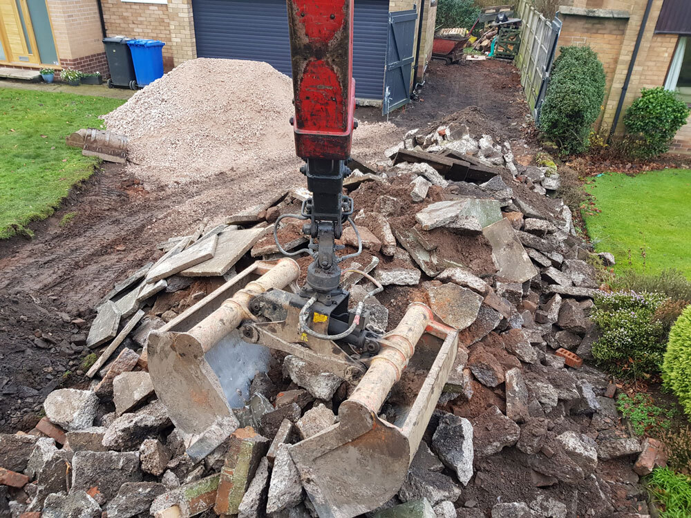 removing waste concrete from a driveway