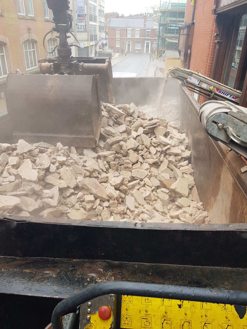 Removing concrete waste from a site.