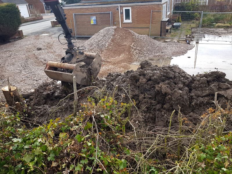 Stone delivered and wet soil removed from the site.