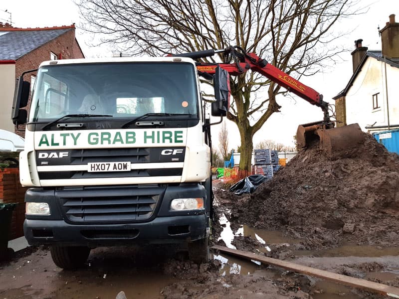 Removing wet clay from a site