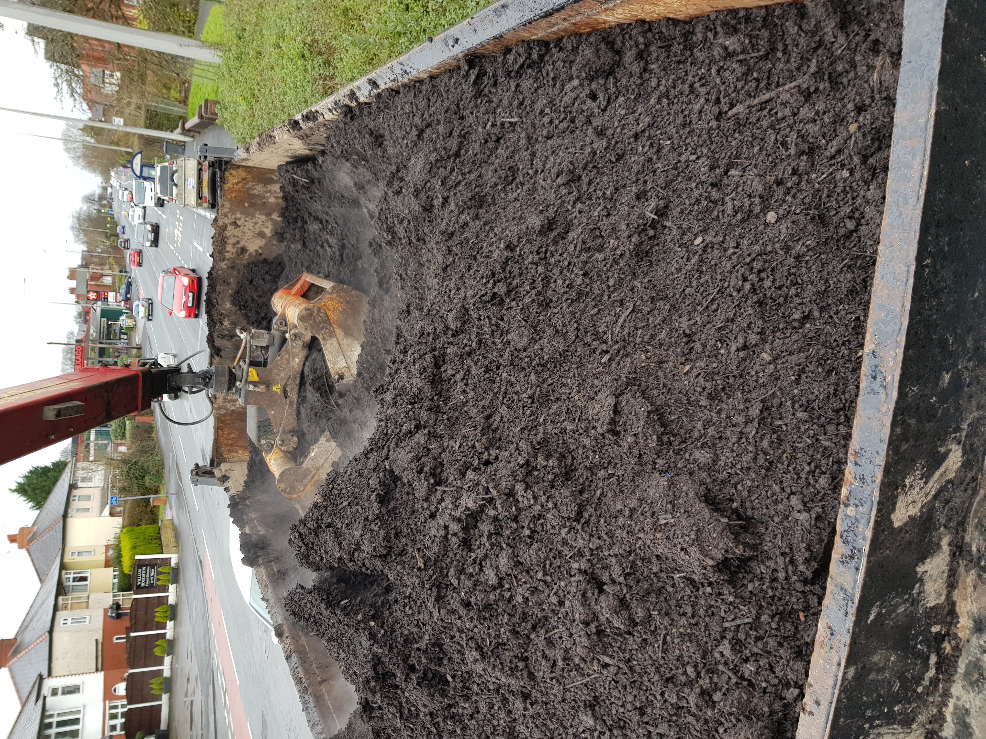 Topsoil delivery using our grab hire